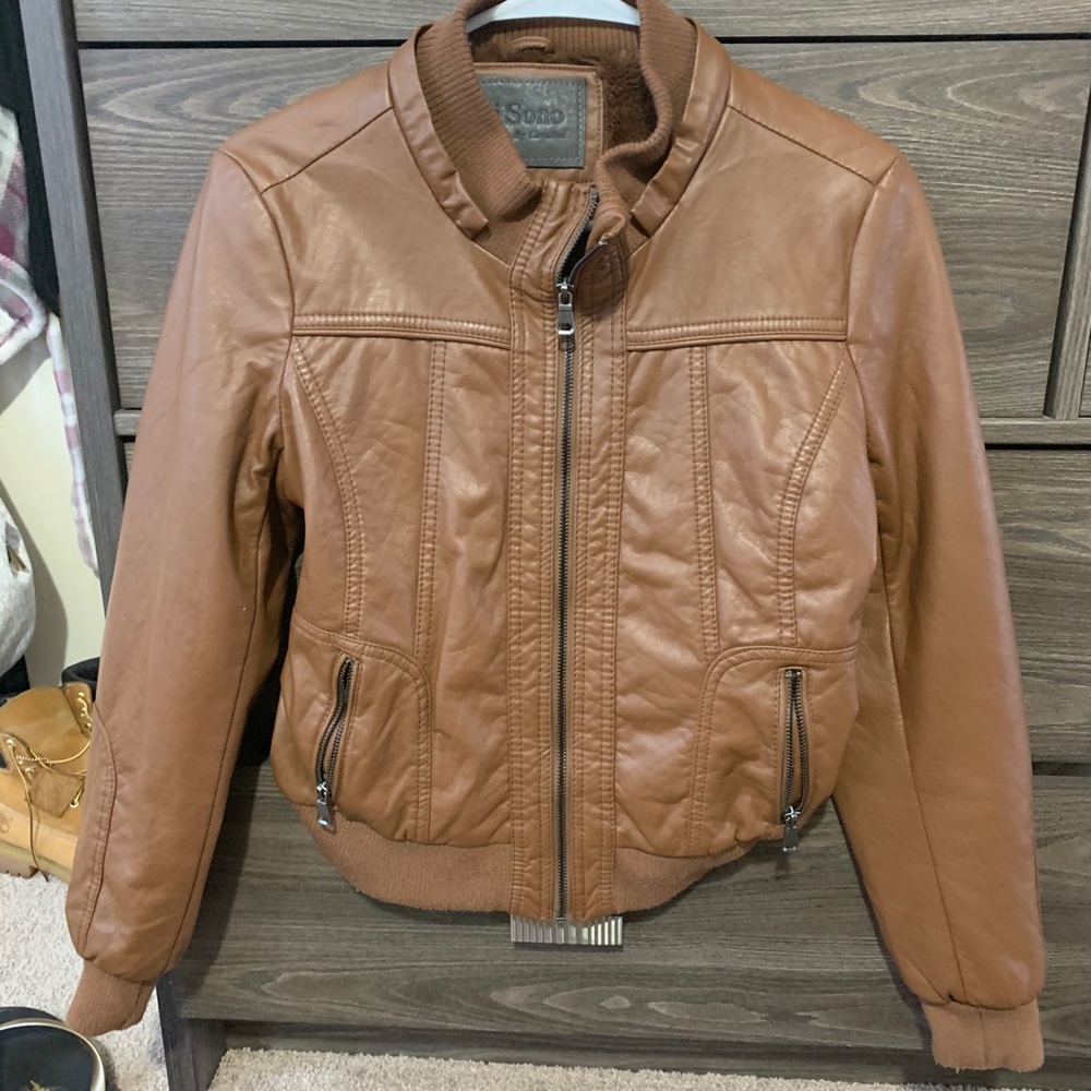 Woman's brown leather coat fun for going out